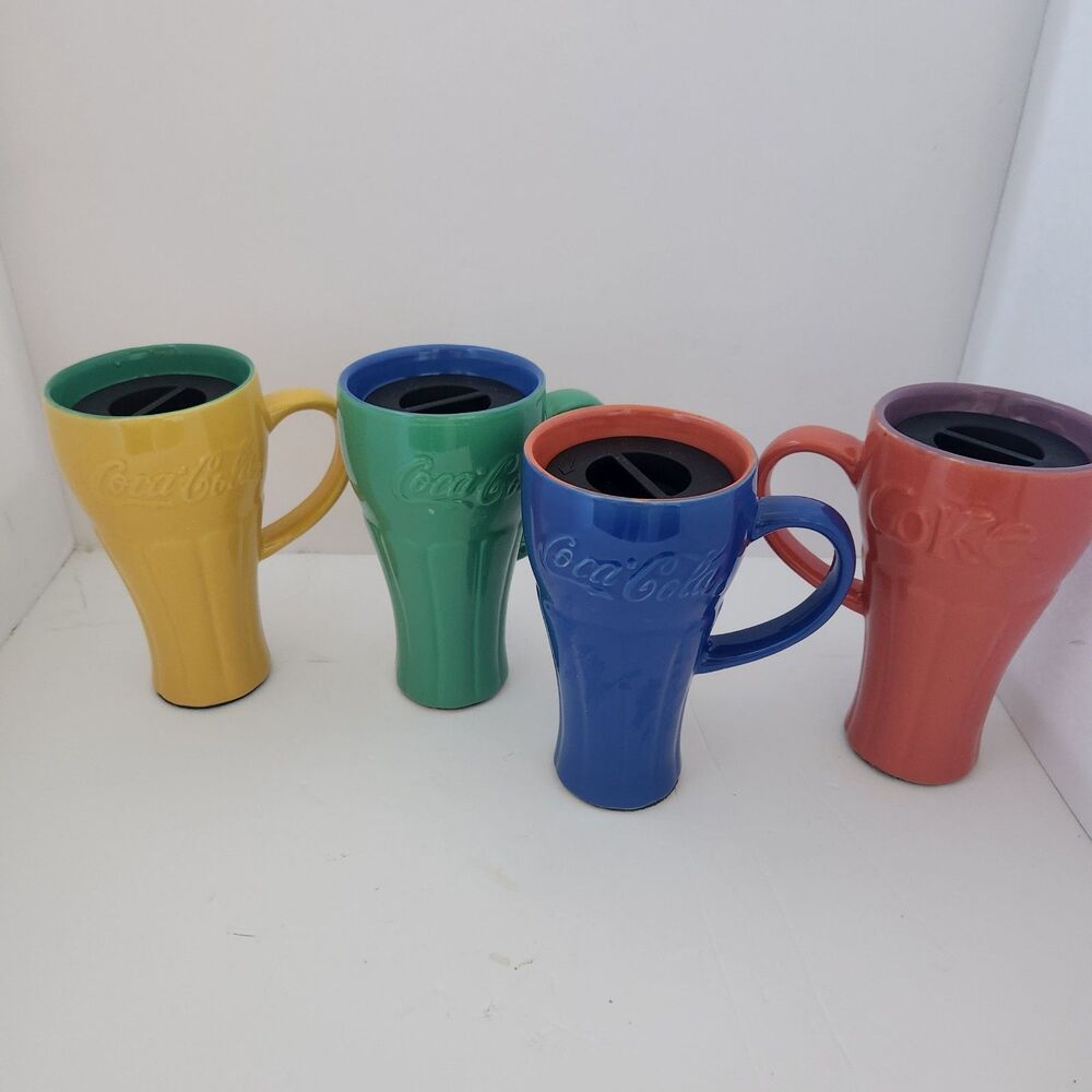 Coco-Cola ceramic travel mugs with lids.  Complete set of 4